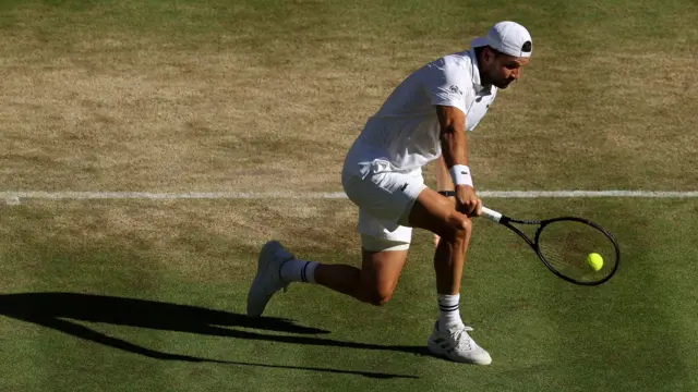 Grigor Dimitrov hits a backhand