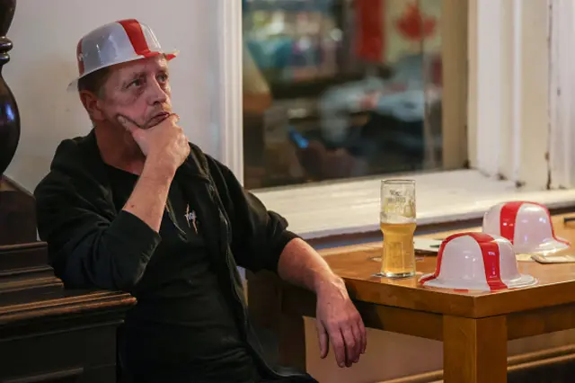 An England supporter waits for the start