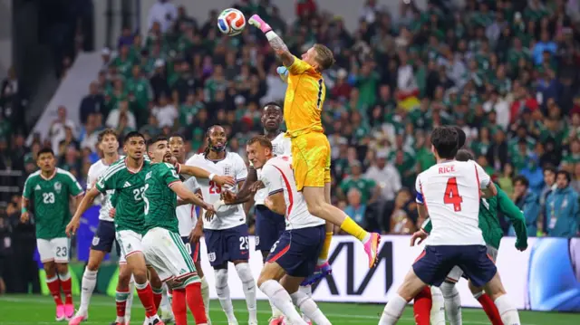 Jordan Pickford of England punches the ball away during the FIFA World Cup 2026 Round Of 16 match between Mexico and England at Mexico City Stadium on July 5, 2026 in Mexico City, Mexico