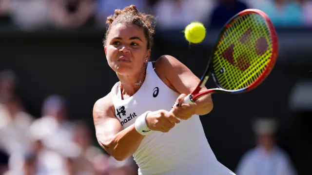 Jasmine Paolini hits a backhand