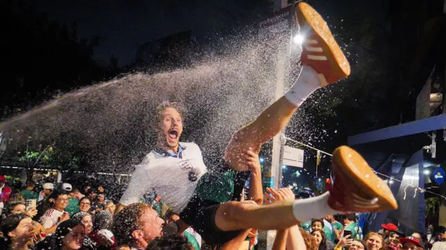 England fan held in the air