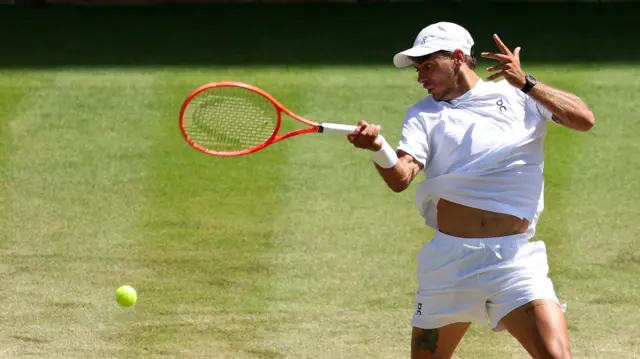 Flavio Cobolli hits a forehand