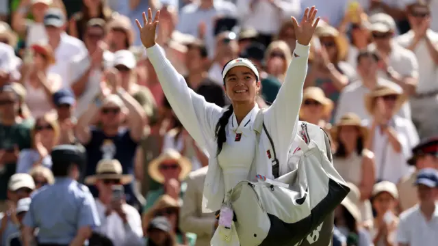 Alexandra Eala waves to the crowd