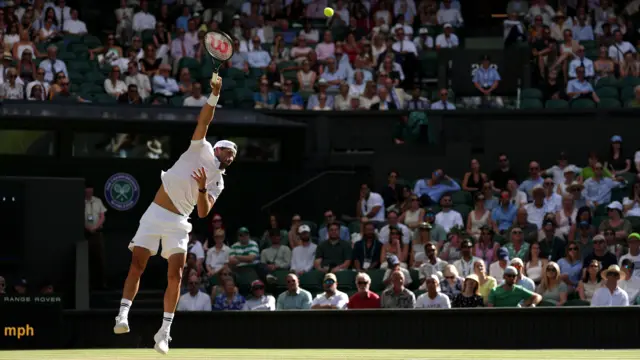 Grigor Dimitrov serves