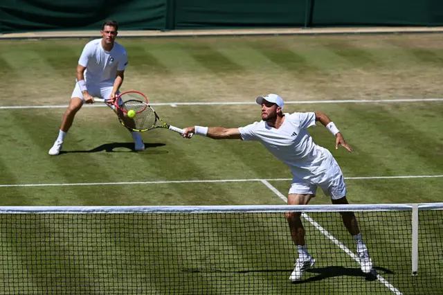 Neal Skupski (back) and Christian Harrison in action on Monday