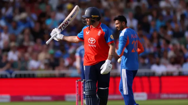 Phil Salt raises his bat