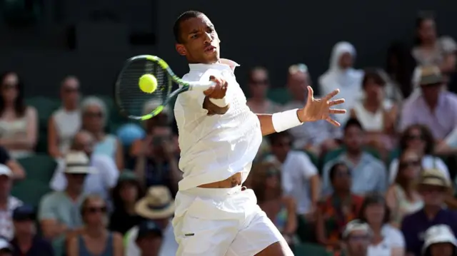 Felix Auger-Aliassime of Canada plays a forehand