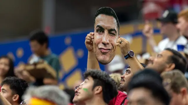 A fan holds up a picture of Cristiano Ronaldo of Portugal's face during the FIFA World Cup 2026 Round of 16 match between Portugal and Spain at Dallas Stadium on July 6, 2026 in Arlington, Texas.