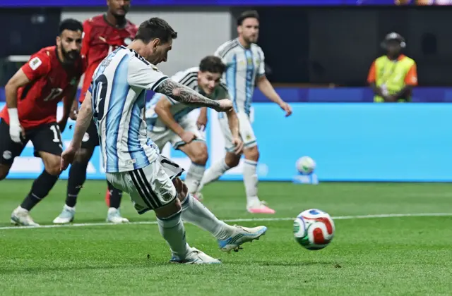 Lionel Messi takes a penalty