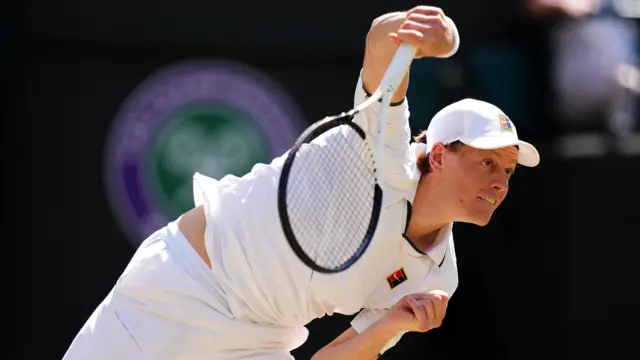 Jannik Sinner serves