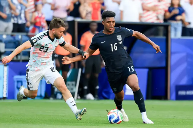 Alex Freeman of the United States is challenged by Nicolas Raskin