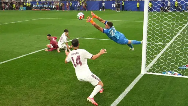Unai Simon makes a diving save