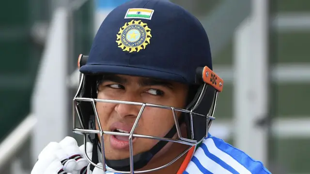 Vaibhav Sooryavanshi adjusts his helmet strap
