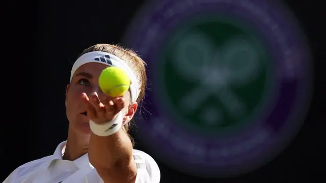 Karolina Muchova serves