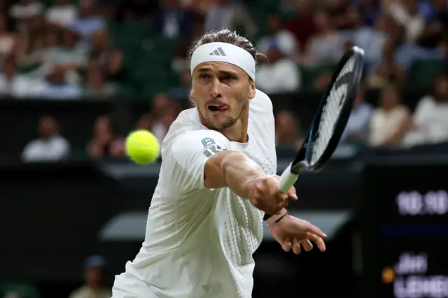 Alexander Zverev reaches for a backhand shot