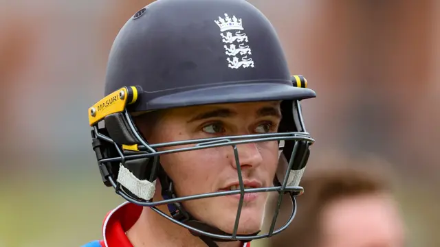 England batter Jacob Bethell smiles wearing his helmet