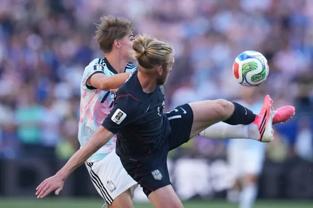 Tim Ream (13) of USA in action against Charles De Ketelaere