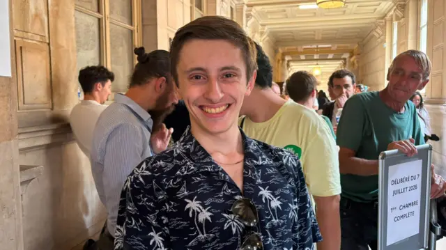Alexandre Mahoudeaux smiles at the Palais de Justice