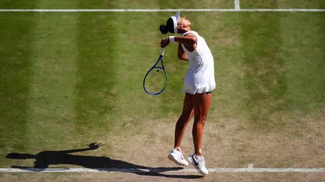 Naomi Osaka serves