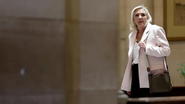 rench far-right leader Marine Le Pen, member of parliament for the Rassemblement National (National Rally - RN) party, leaves after the verdict in her appeal trial, alongside the RN party itself and 10 others defendants found guilty of diverting European Parliament funds, at the Paris courthouse on the Ile de la Cite, in Paris, France, July 7, 2026.