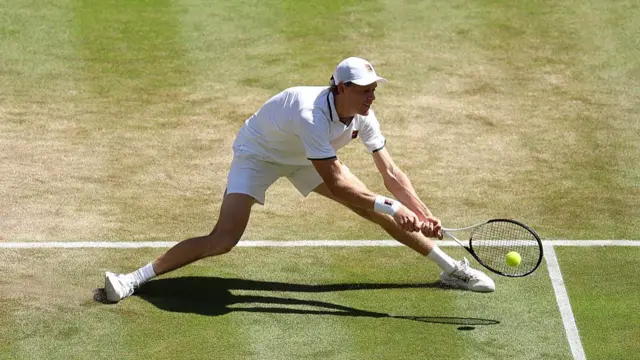 Jannik Sinner of Italy plays a backhand
