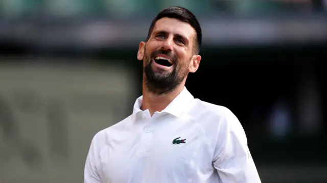Novak Djokovic laughs