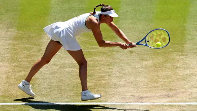 Elise Mertens hits a backhand