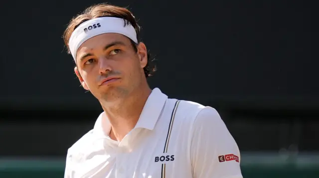 Taylor Fritz looks frustrated