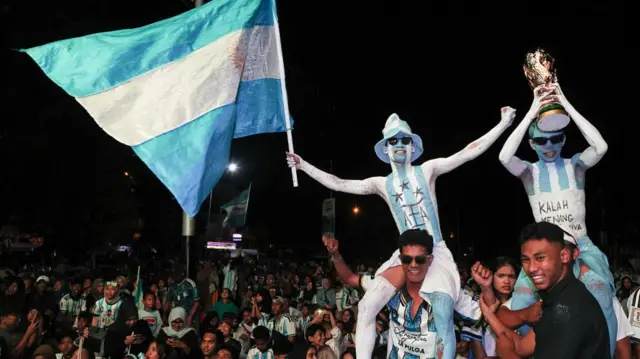 Argentina supporters react as they watch a live broadcast of the 2026 FIFA World Cup round of 16 match between Argentina and Egypt, won 3-2 by Argentina, during a public viewing in Ternate, North Maluku, Indonesia, on July 8, 2026.