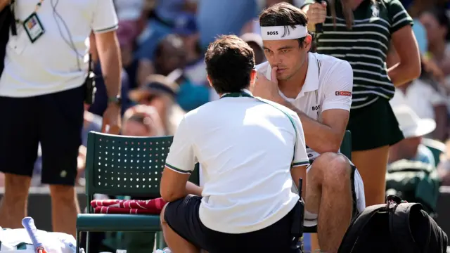 Taylor Fritz speaks to a physio