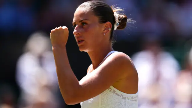 Marta Kostyuk celebrates with a clenched fist