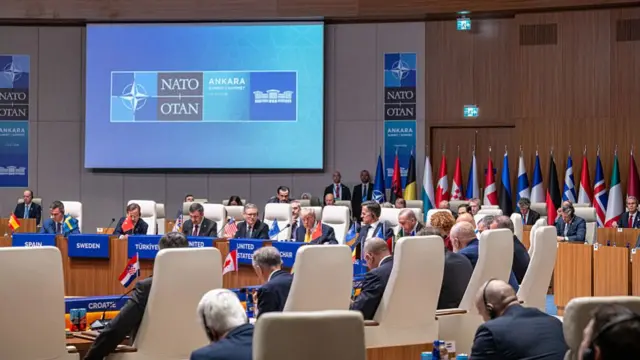 A wide shot of the Nato summit in Ankara. A meeting is underway with world leaders
