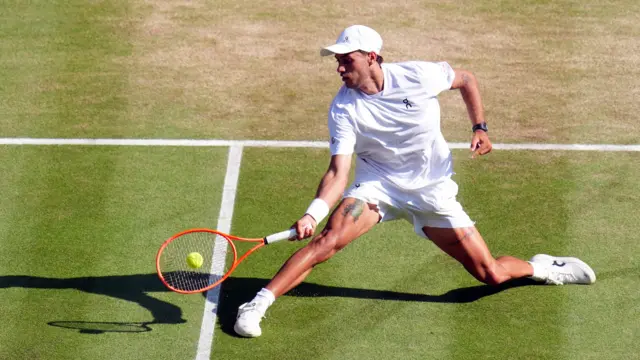 Flavio Cobolli hits a forehand
