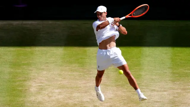 Flavio Cobolli hits a forehand