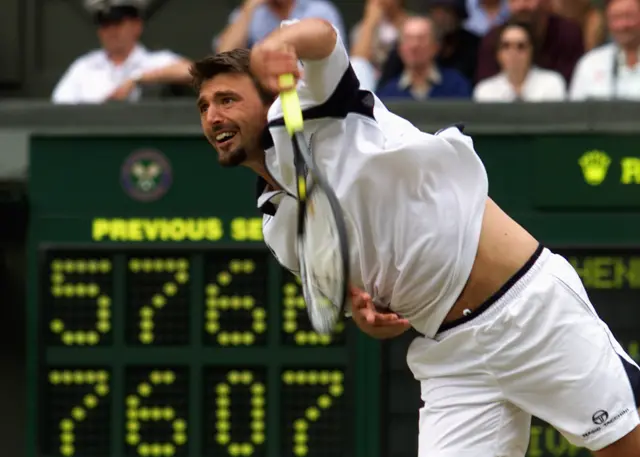 Croatian player Goran Ivanisevic serves during his semi final match against Britain's Tim Henman at the All England Tennis Championships, 08 July 2001. Ivanisevic won 7-5, 6-7, 0-6, 7-6, 6-3