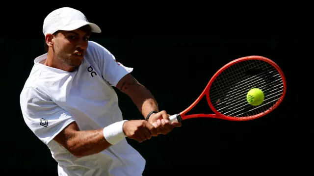Flavio Cobolli hits a backhand