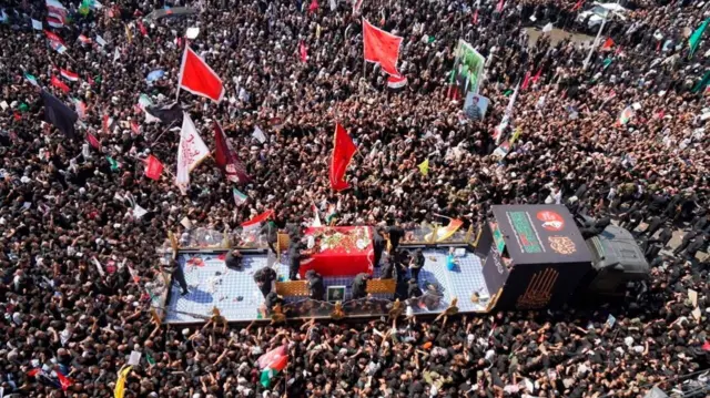 People attend a funeral procession for Iran's late Supreme Leader Ayatollah Ali Khamenei, who was killed on February 28 in Israeli and U.S. airstrikes, in Najaf, Iraq, July 8,
