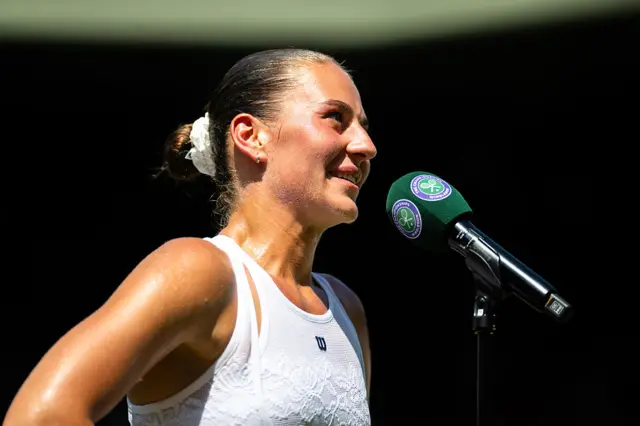 Marta Kostyuk speaking into a microphone