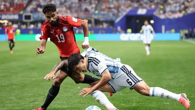 Lisandro Martinez #6 of Argentina competes for the ball against Marawan Attia #19 of Egypt during the FIFA World Cup 2026 Round of 16 match between Argentina and Egypt at Atlanta Stadium on July 07, 2026 in Atlanta, Georgia.