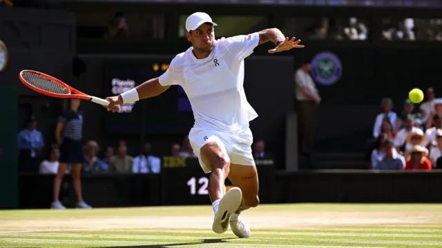 Flavio Cobolli hits a forehand