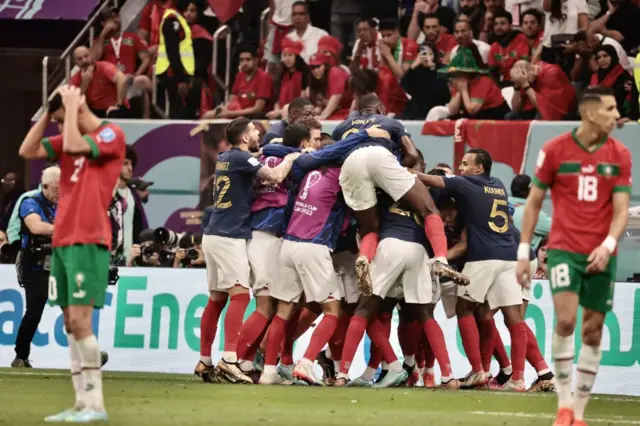 France celebrate as Morocco look deflated
