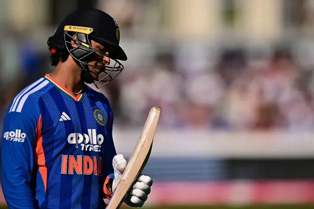 Abhishek Sharma walks off looking at the bottom of his bat