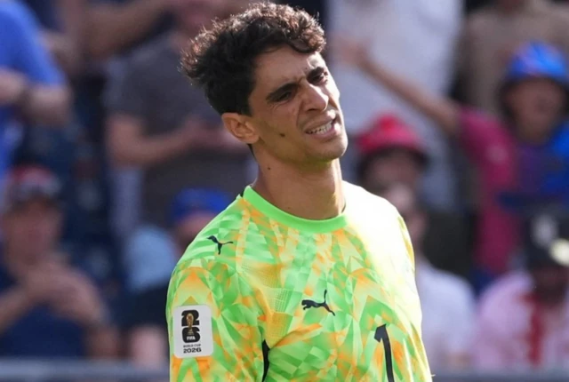 Morocco's Yassine Bounou looks dejected after France's Ousmane Dembele scored their second