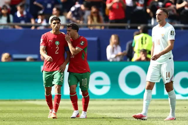 Achraf Hakimi and Morocco's forward #10 Brahim Diaz react