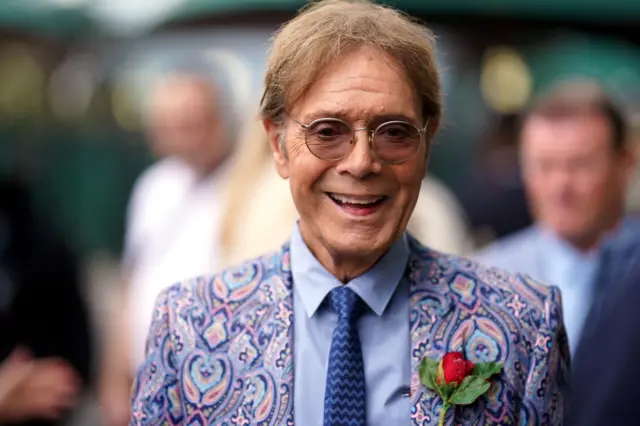 Cliff Richard smiling while looking at camera