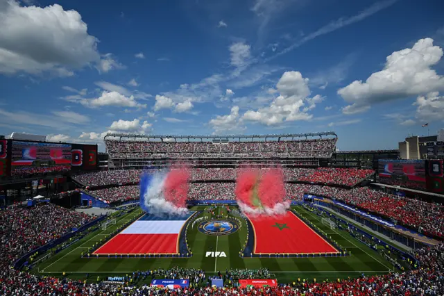 Fireworks of France and Morocco flags go off after the anthems