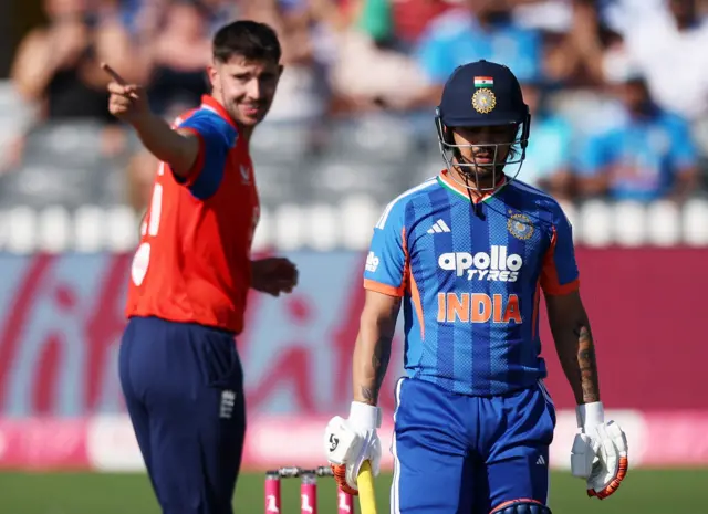 India's Ishan Kishan walks after losing his wicket, caught by England's Sam Curran off the bowling of Josh Tongue