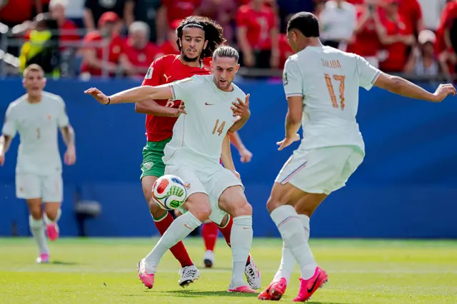 Bouaddi tackles Rabiot in midfield