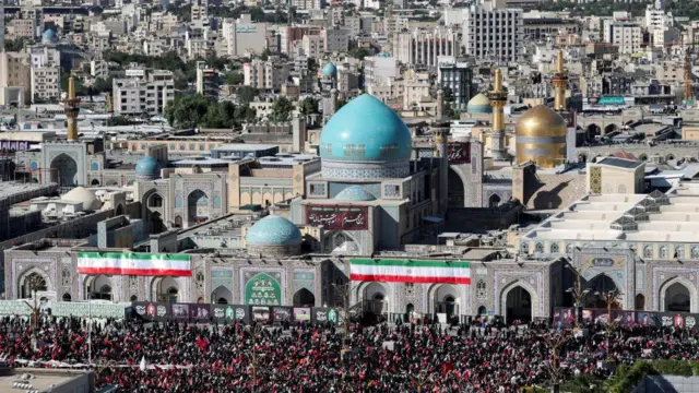 Mourners gather by Imam Reza shrine, on the day of of the burial of Iran's late Supreme Leader Ayatollah Ali Khamenei
