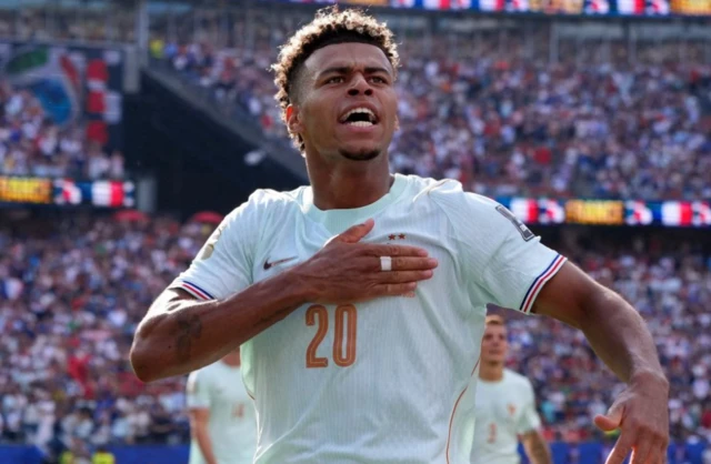 France's Desire Doue celebrates after Kylian Mbappe scored